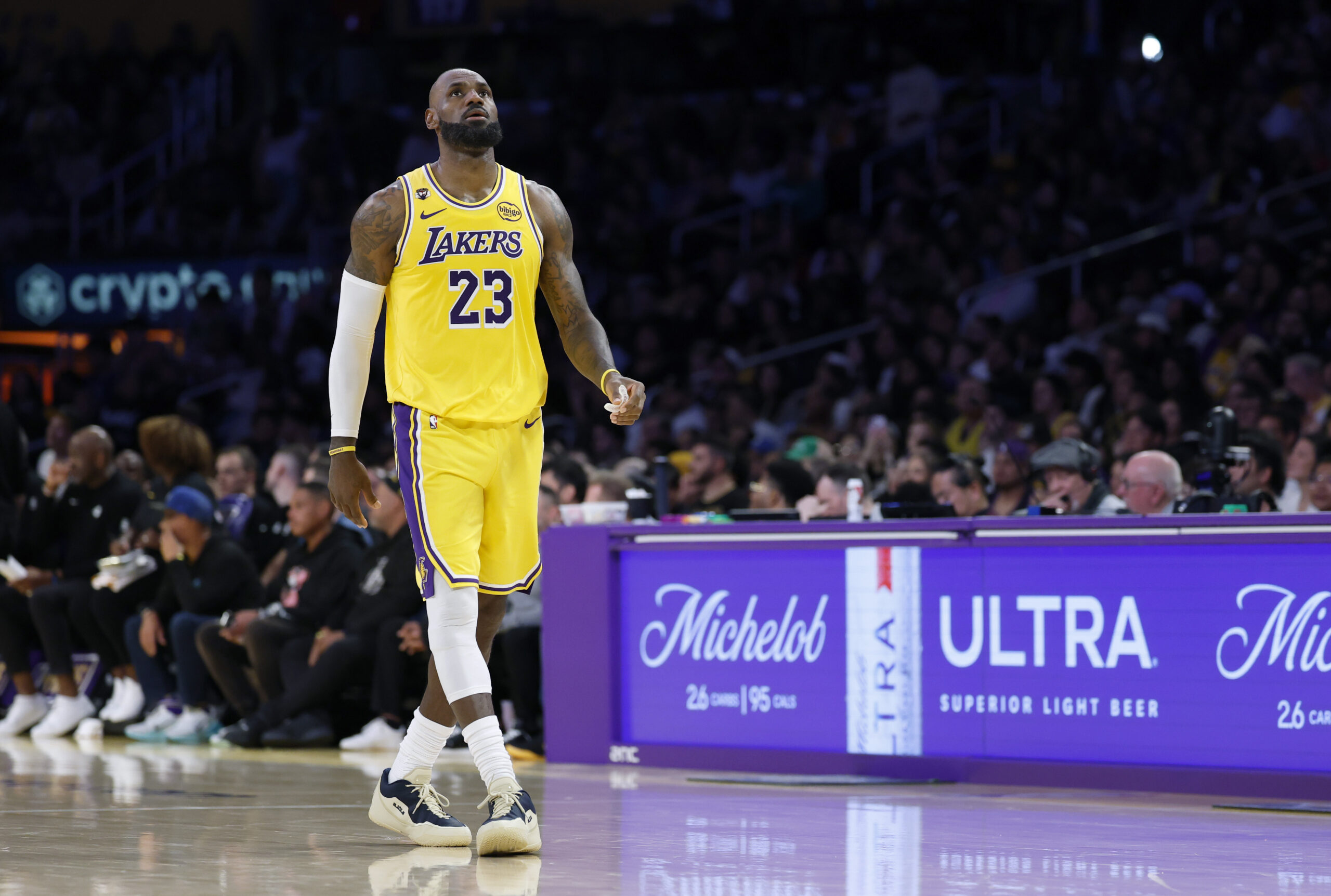Lakers star LeBron James reacts as he walks down the...