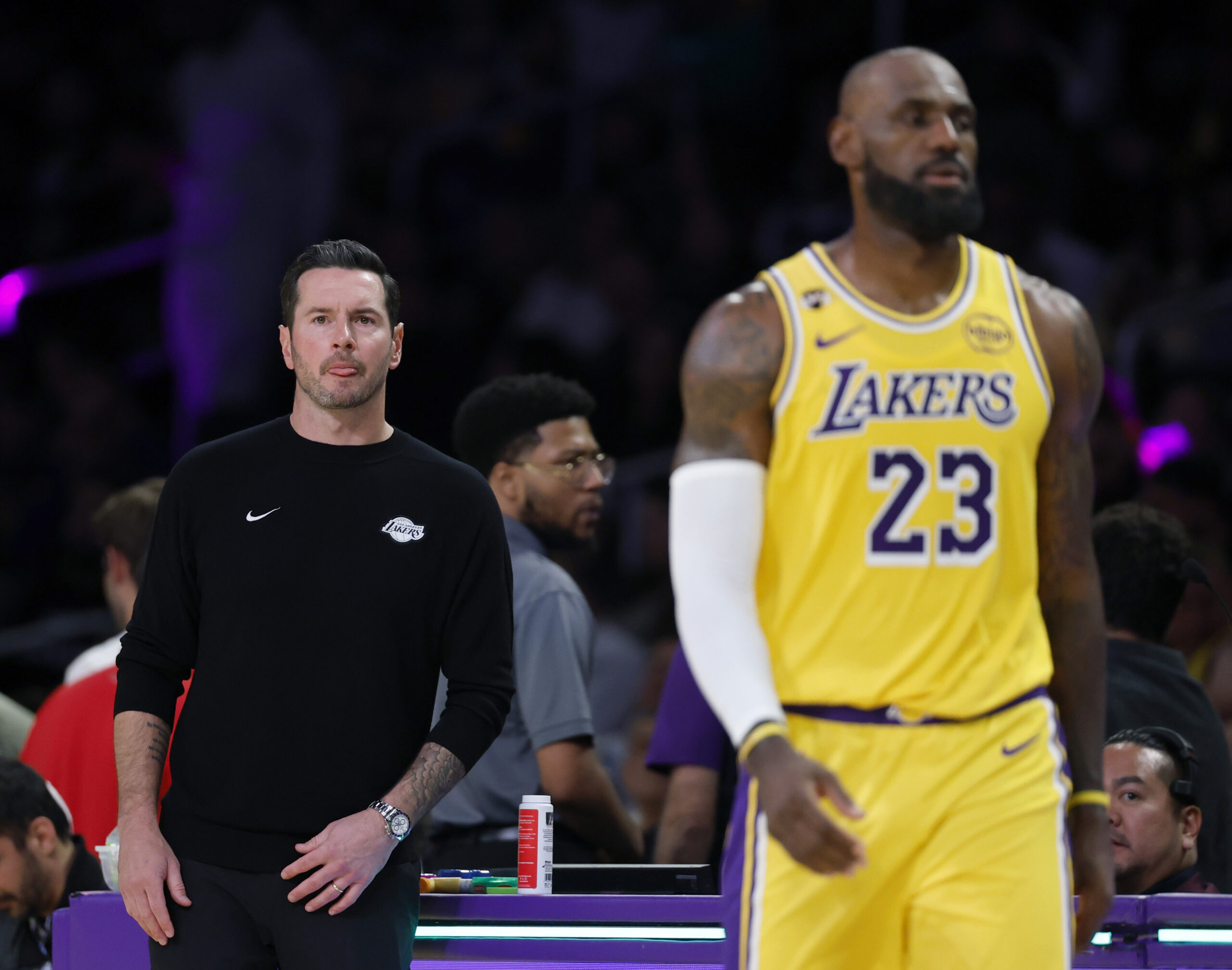Lakers head coach JJ Redick and forward LeBron James look...