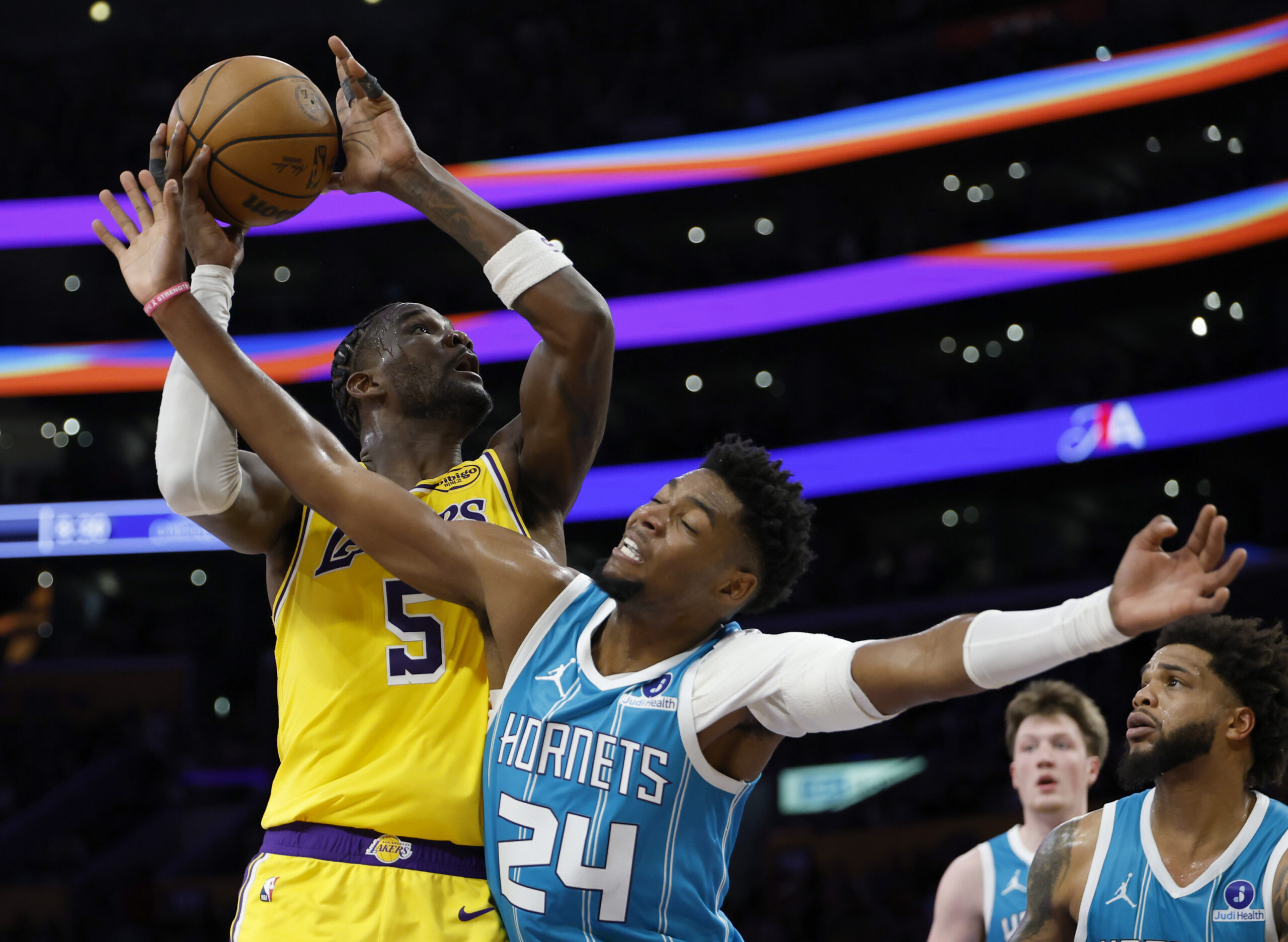 Lakers center Deandre Ayton attempts a shot as the Charlotte...