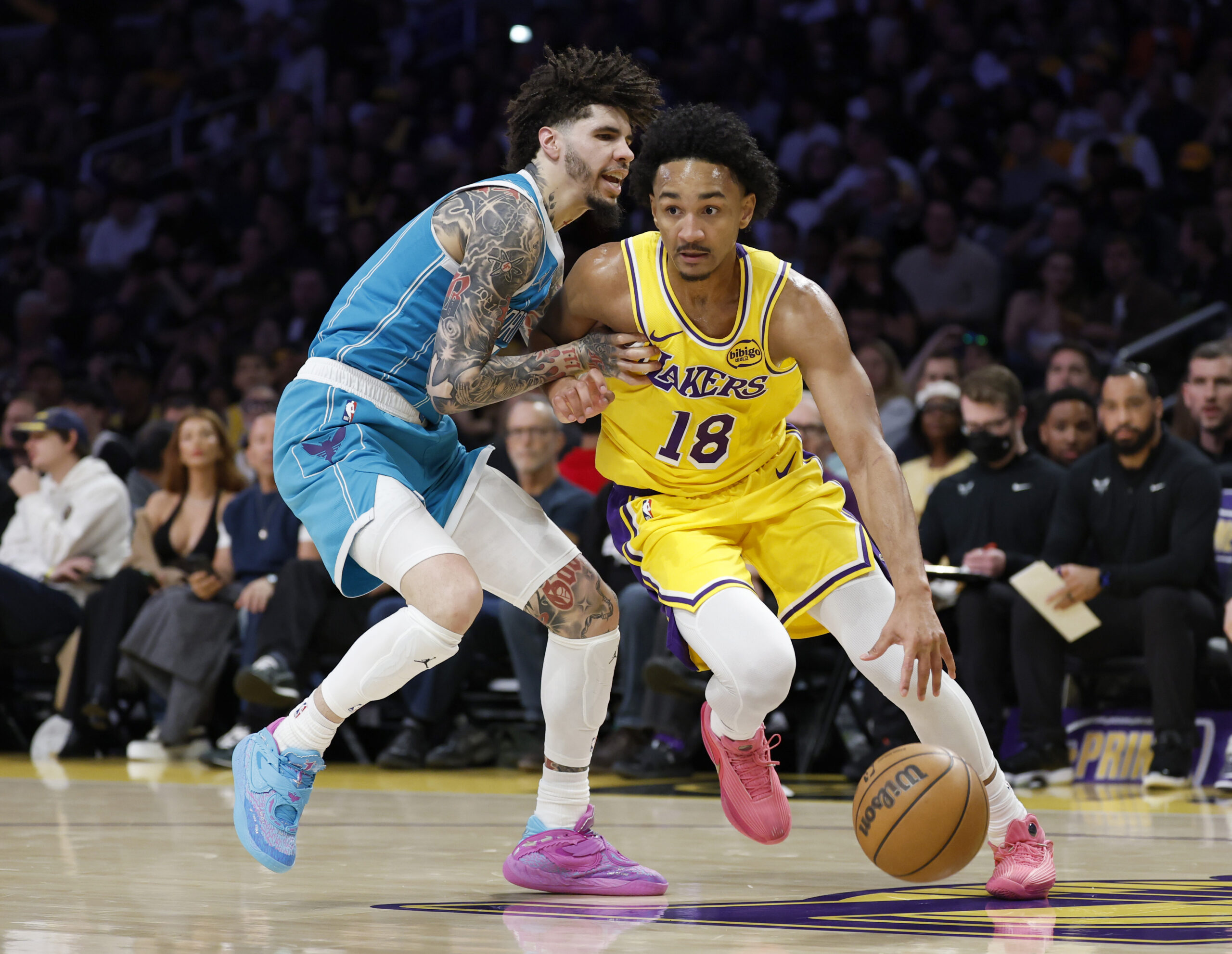 Lakers guard Kobe Bufkin drives as Charlotte Hornets guard LaMelo...