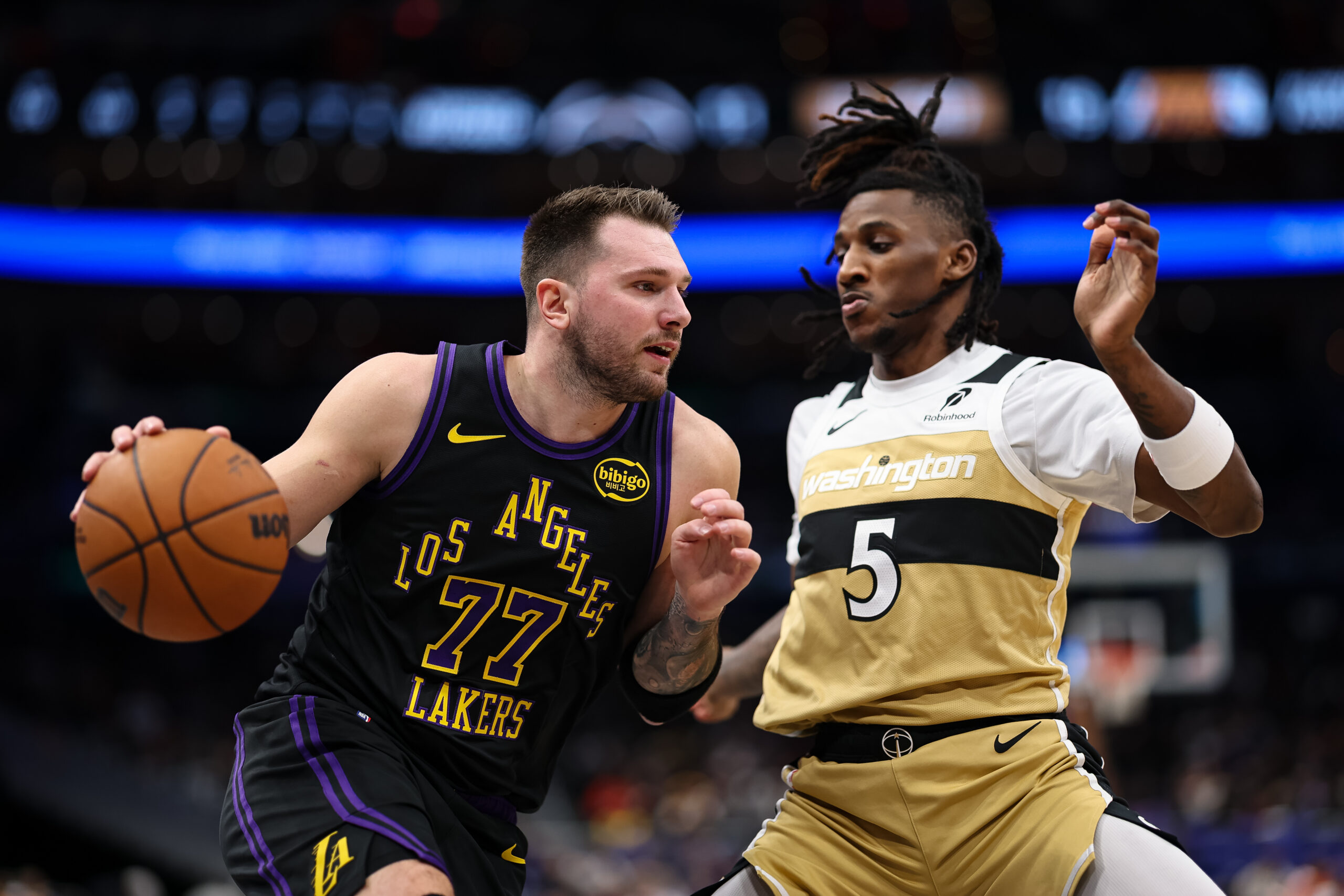 Lakers star Luka Doncic drives to the basket as the...