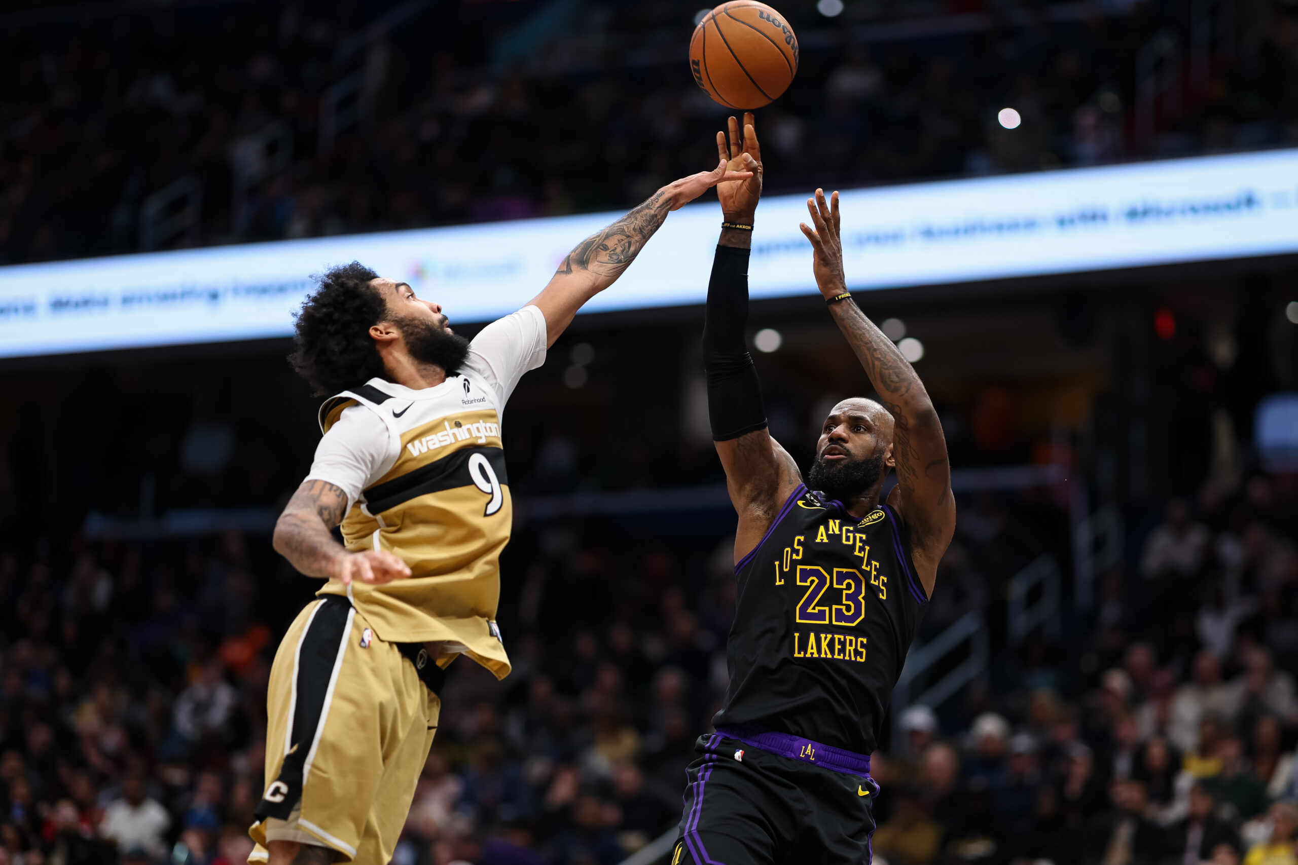 Lakers star LeBron James shoots as the Washington Wizards’ Justin...