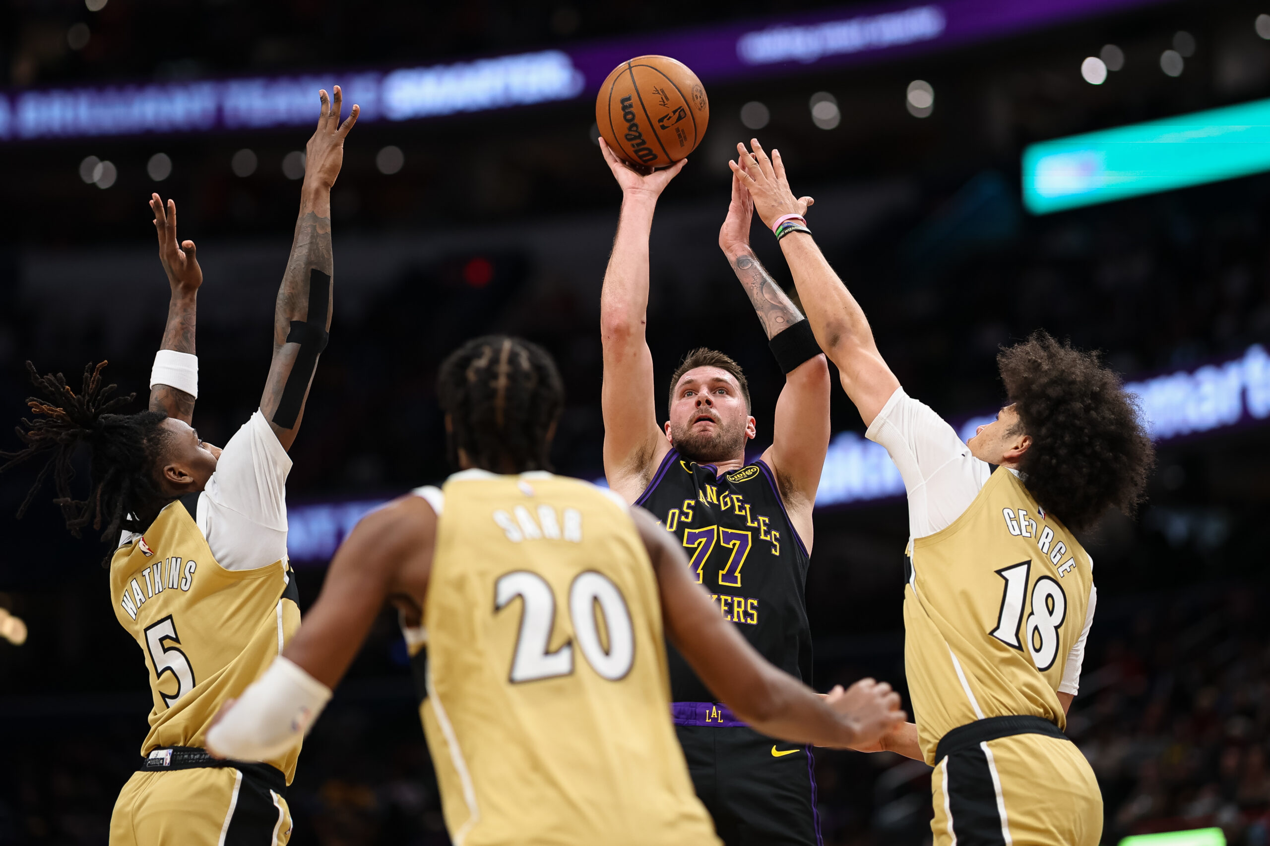 Lakers star Luka Doncic takes a shot in front of...