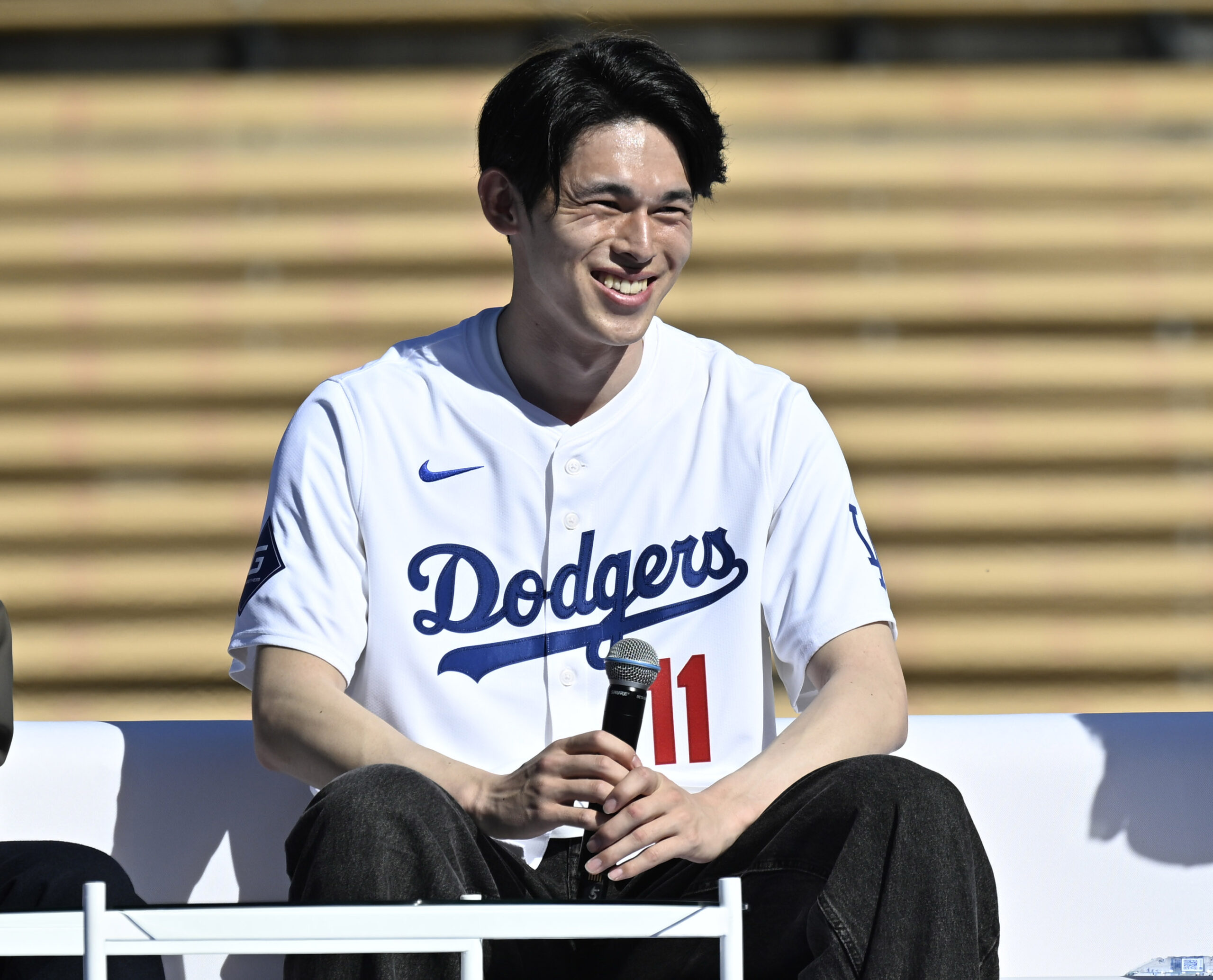 Roki Sasaki #11 of the Los Angeles Dodgers smiles during...
