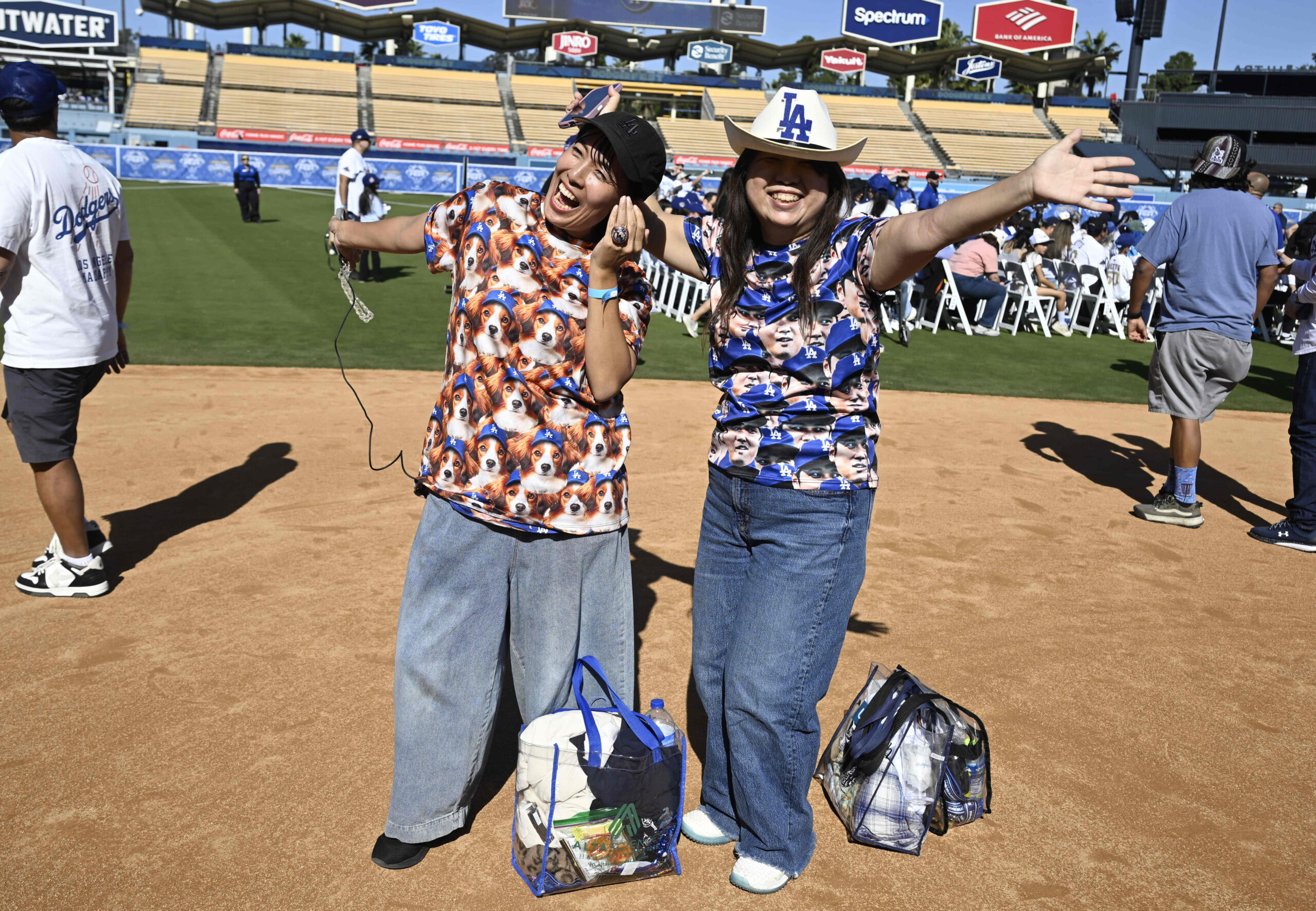 Shohei Ohtani fans wearing a t-shirt with his likeness and...