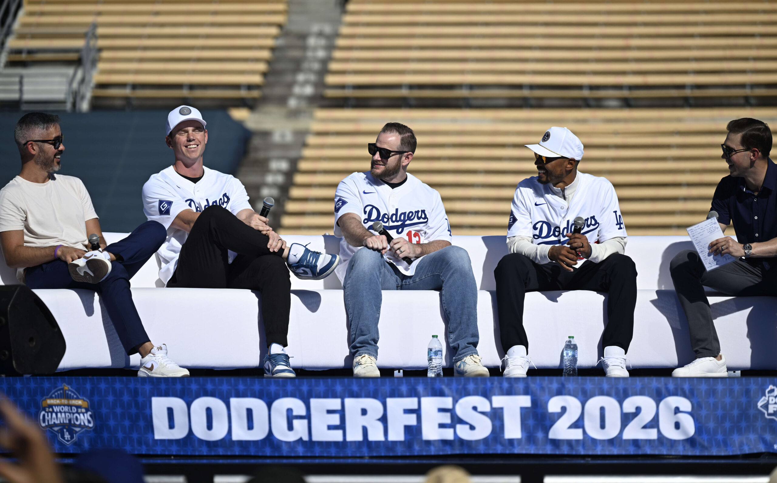 Commentator Stephen Nelson, left, reacts along with Will Smith, Max...