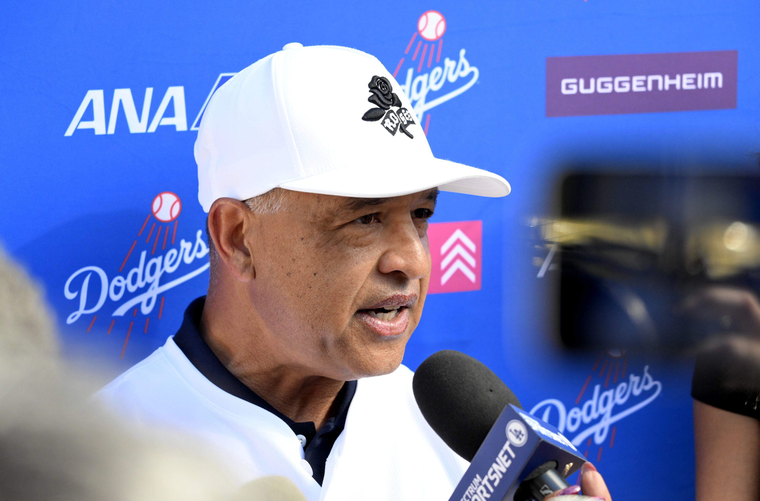 Manager Dave Roberts of the Los Angeles Dodgers speaks to...