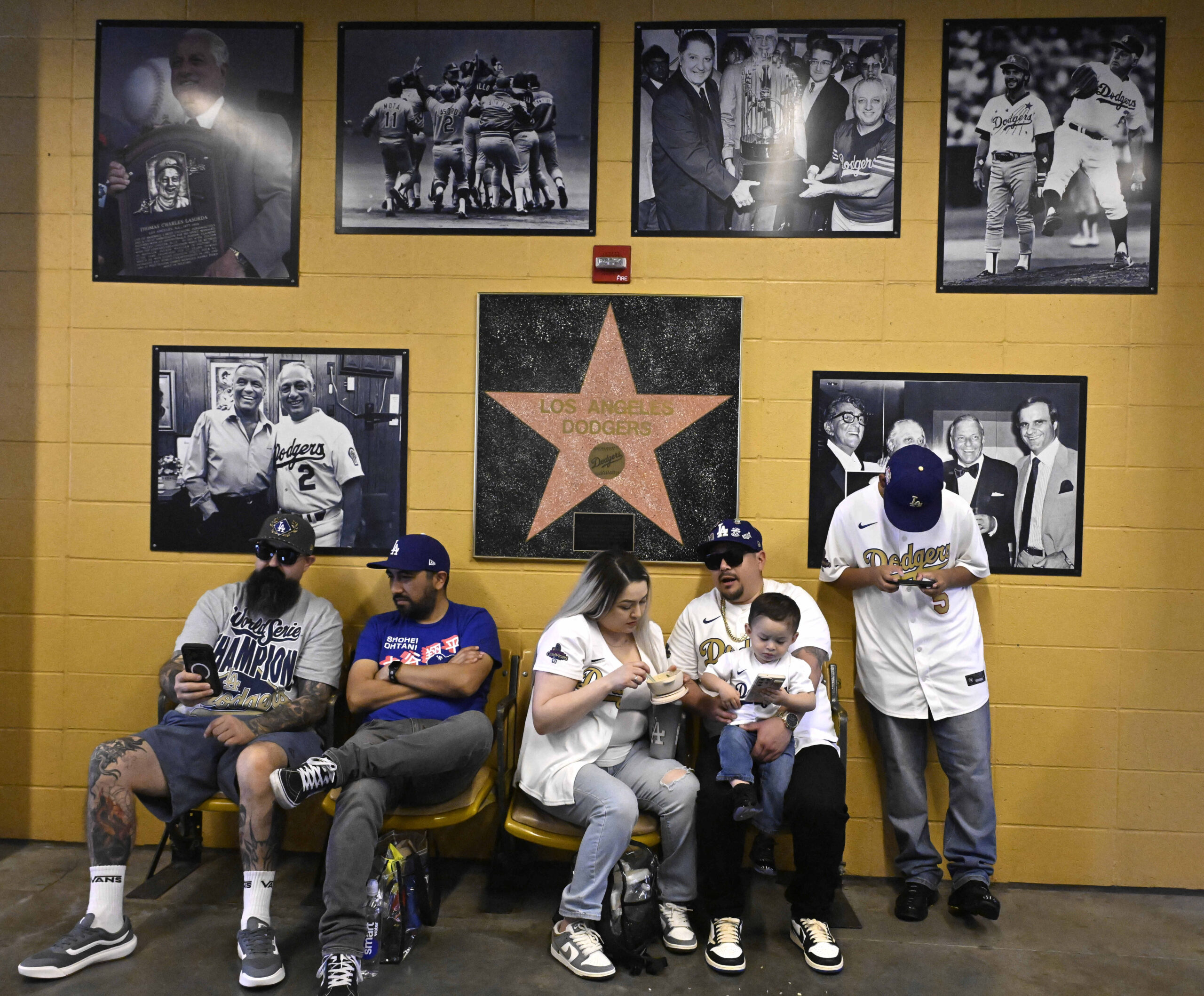 Dodger fans wait in the shade on a hot day...