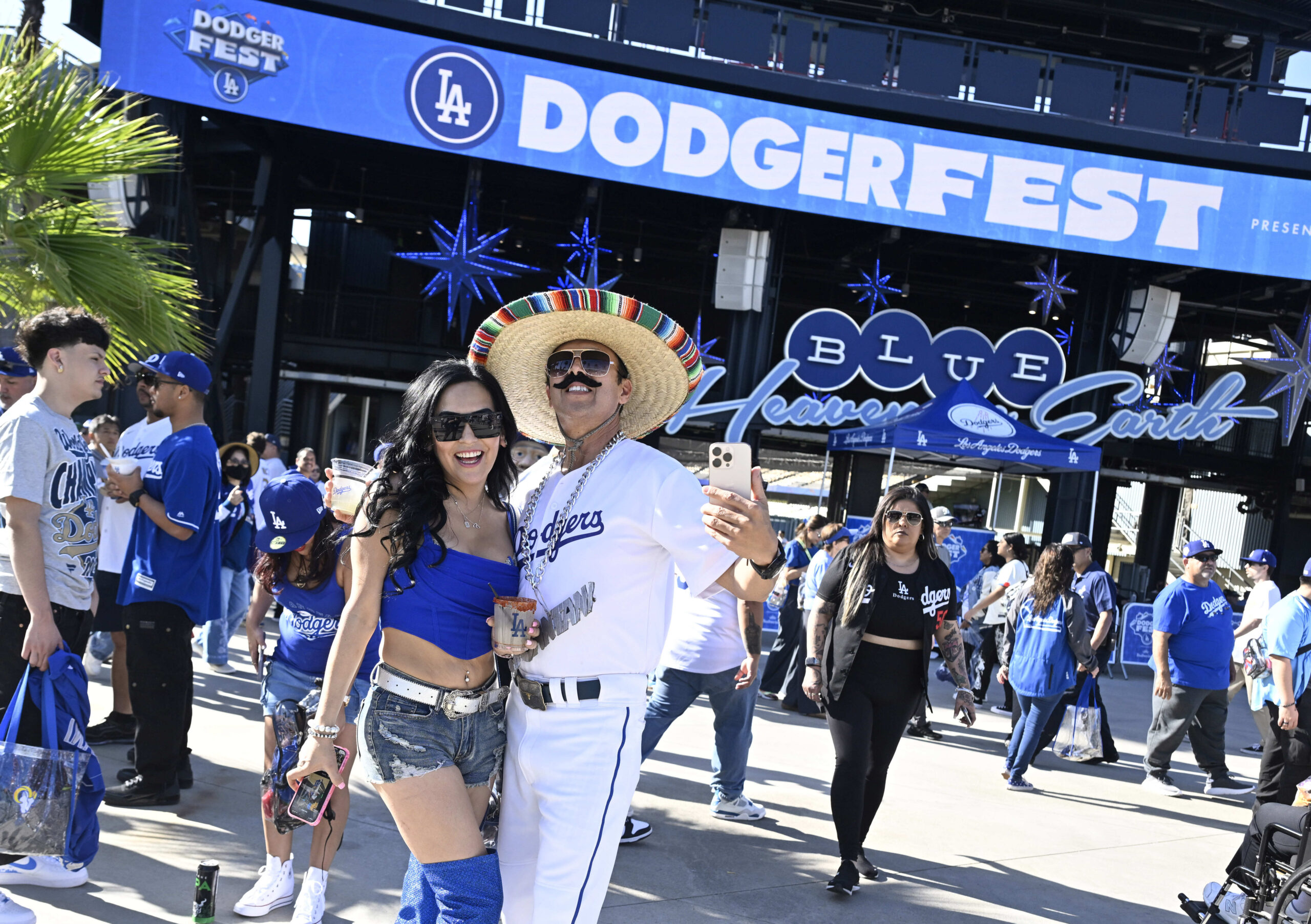 Dodger fan Juantani poses with fans during the annual DodgerFest...