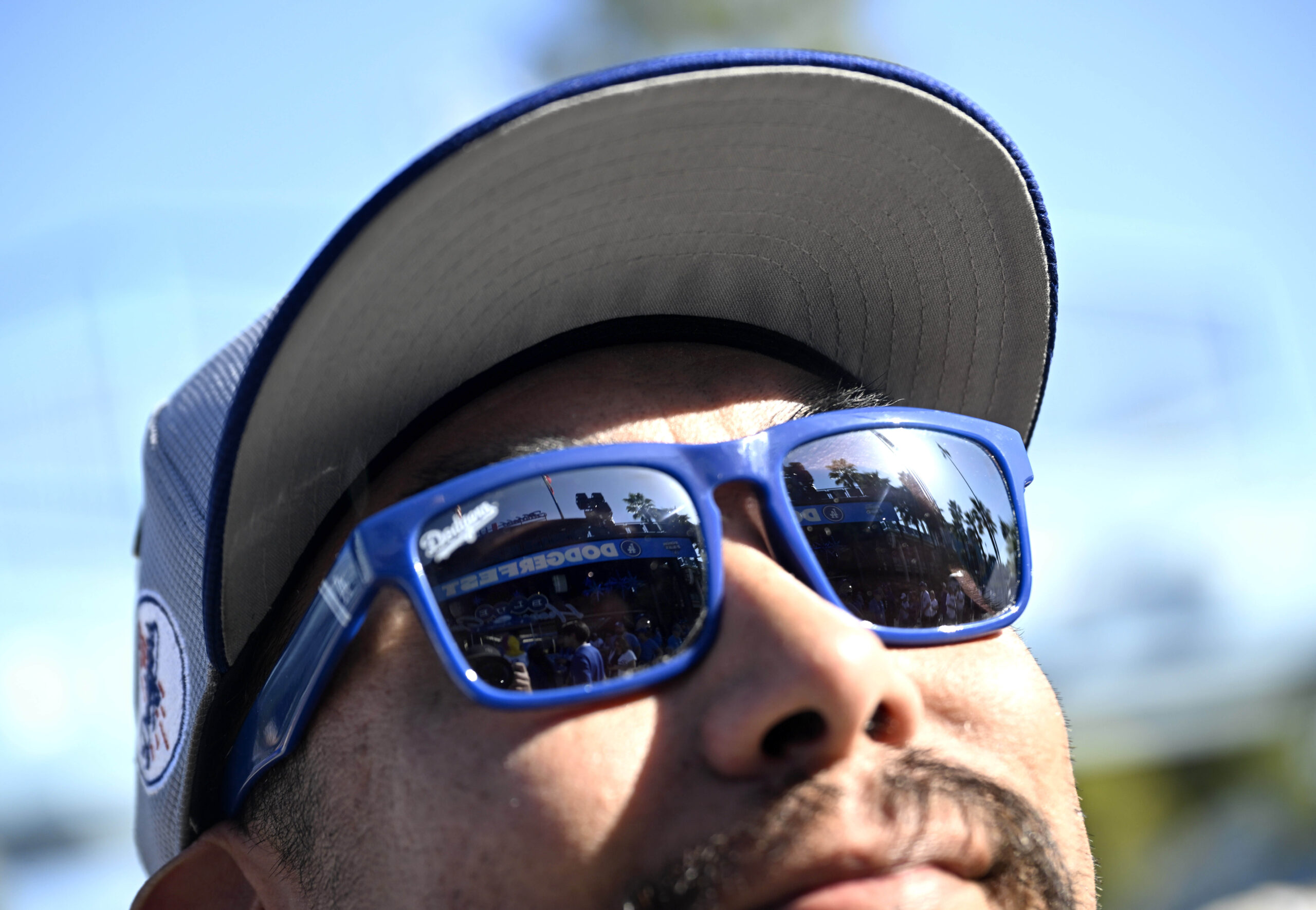 A Dodger fan looks toward the field during the annual...