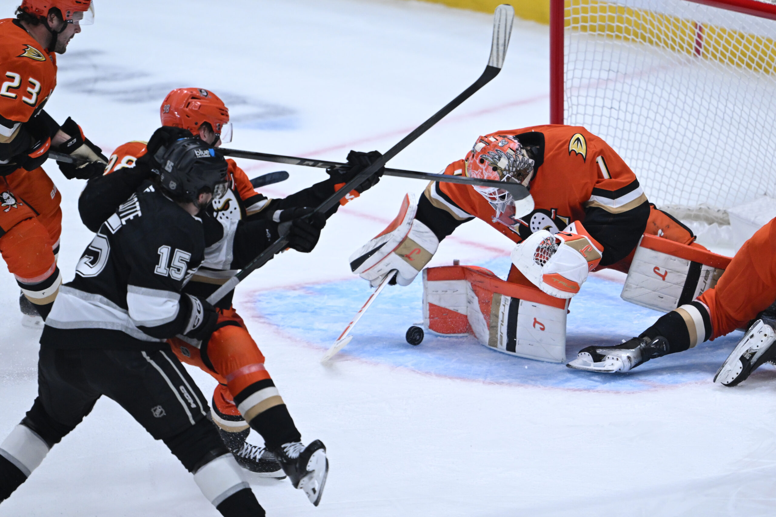 Ducks goaltender Lukas Dostal, right, blocks a shot by the...