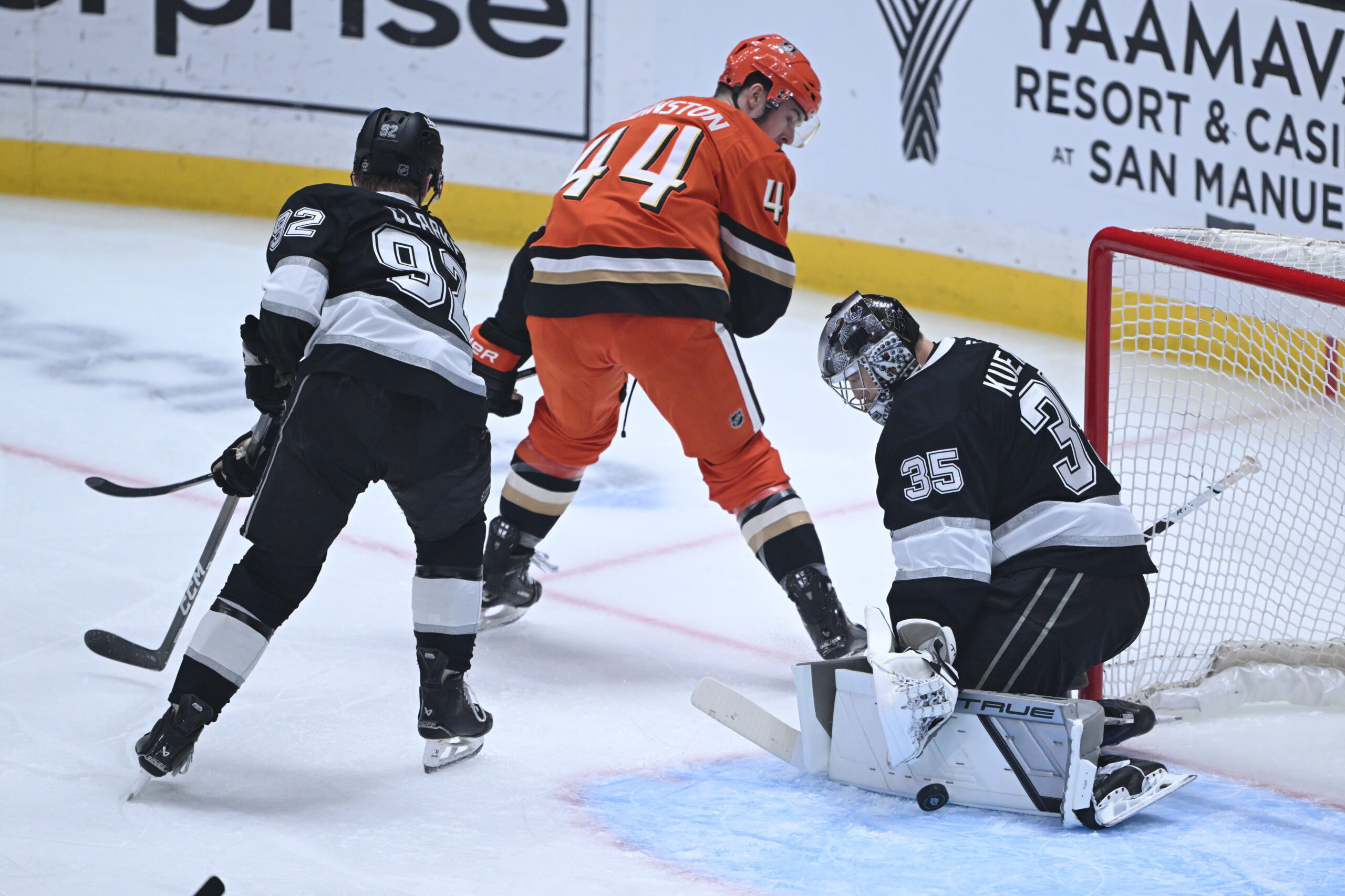 Kings goaltender Darcy Kuemper, right, blocks a shot by the...