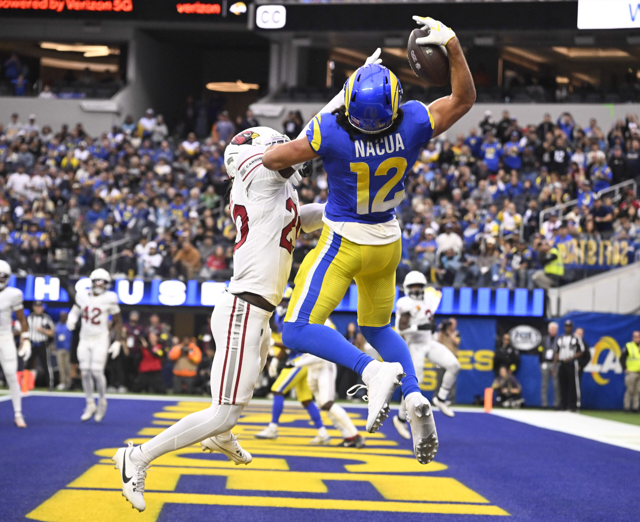 Rams wide receiver Puka Nacua #12 catches a pass in...