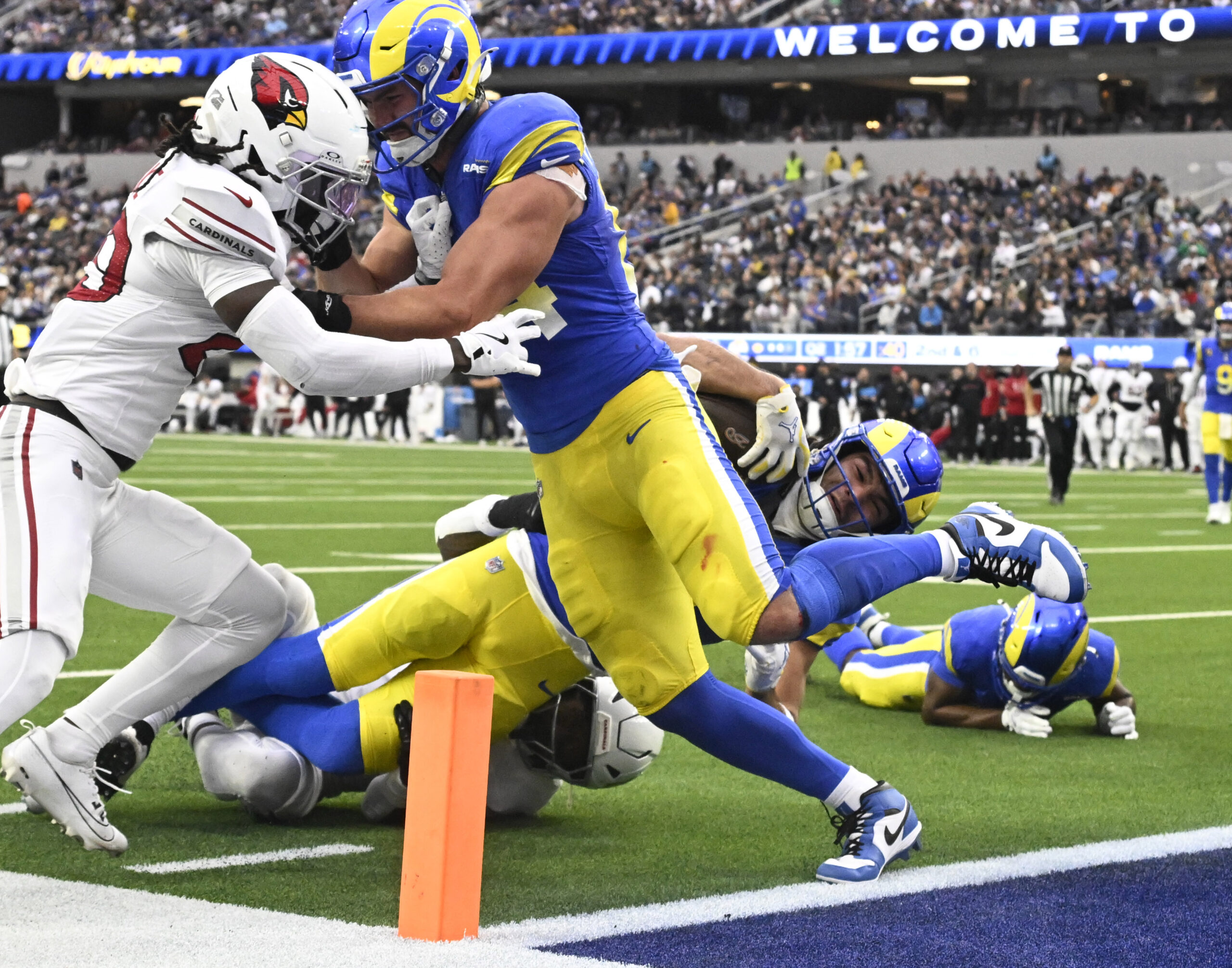 Rams wide receiver Puka Nacua #12 catches a pass for...