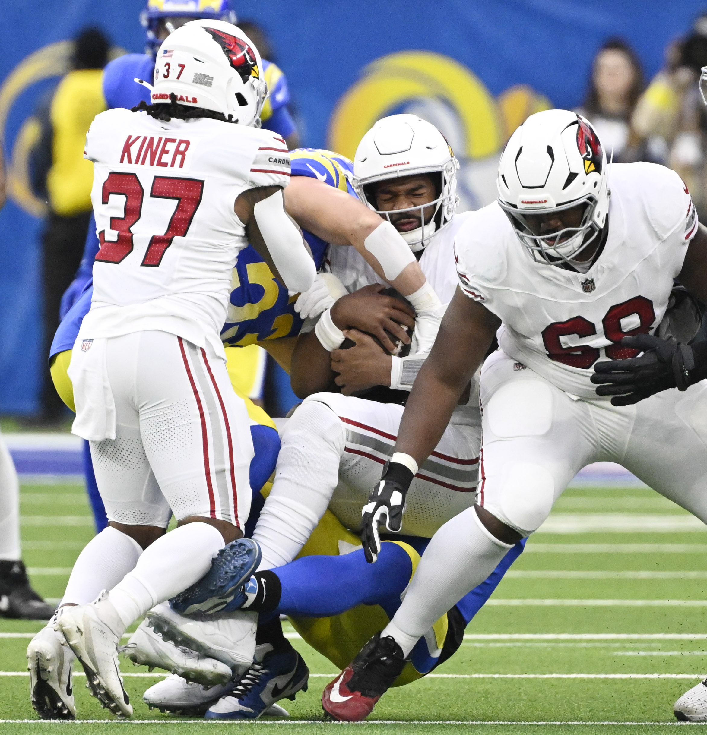Arizona Cardinals quarterback Jacoby Brissett #7 is sacked by Rams...
