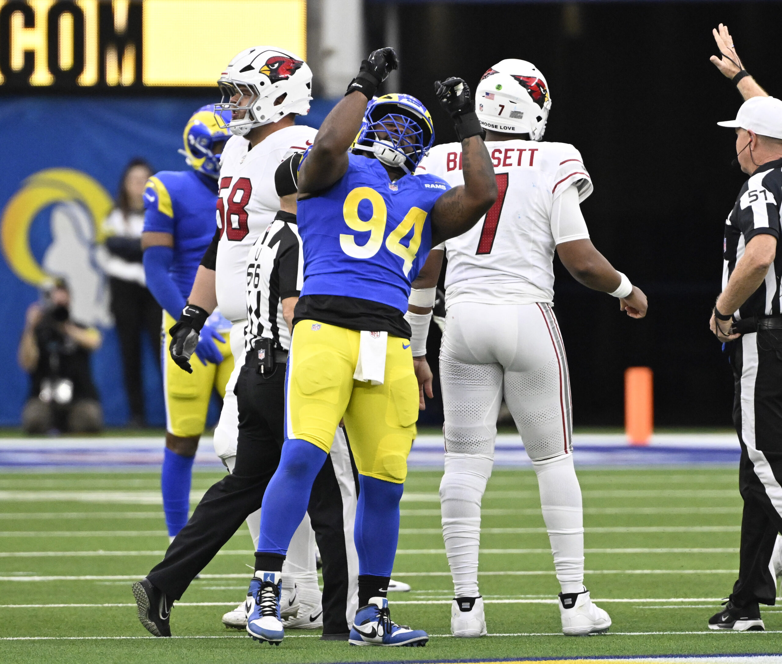 Rams defensive end Desjuan Johnson #94 reacts after a sack...