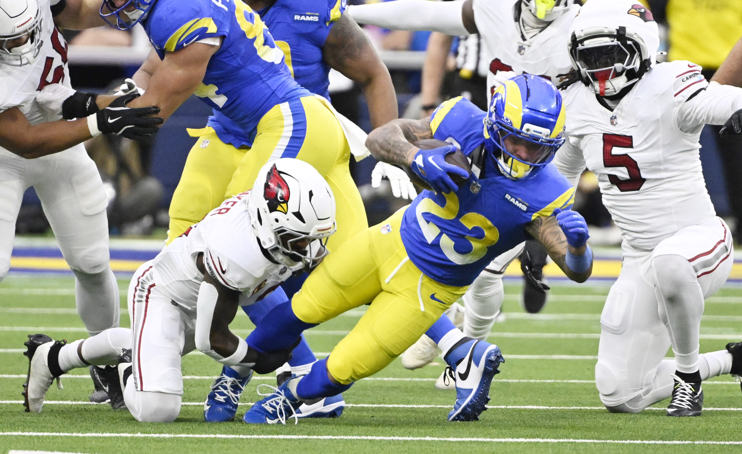 Rams running back Kyren Williams #23 dives for yardage against...