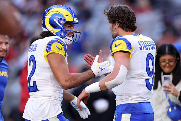 GLENDALE, ARIZONA - DECEMBER 07: Wide receiver Puka Nacua #12 greets quarterback Matthew Stafford #9 of the Los Angeles Rams before the game against the Arizona Cardinals at State Farm Stadium on December 07, 2025 in Glendale, Arizona. The Rams defeated the Cardinals 45-17. (Photo by Chris Coduto/Getty Images) Puka Nacua, Matthew Stafford, Rams