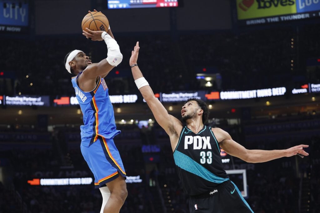 Oklahoma City Thunder guard Shai Gilgeous-Alexander (2) shoots as Portland Trail Blazers forward Toumani Camara (33) defends during the second half at Paycom Center.