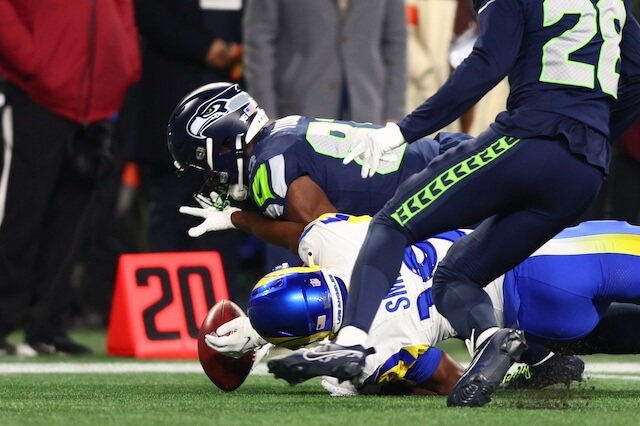 Jan 25, 2026; Seattle, WA, USA; Seattle Seahawks wide receiver Dareke Young (83) recovers a fumbled punt return by Los Angeles Rams wide receiver Xavier Smith (19) during the second half in the 2026 NFC Championship Game at Lumen Field. Mandatory Credit: Kevin Ng-Imagn Images Xavier Smith, Rams, Seahawks
