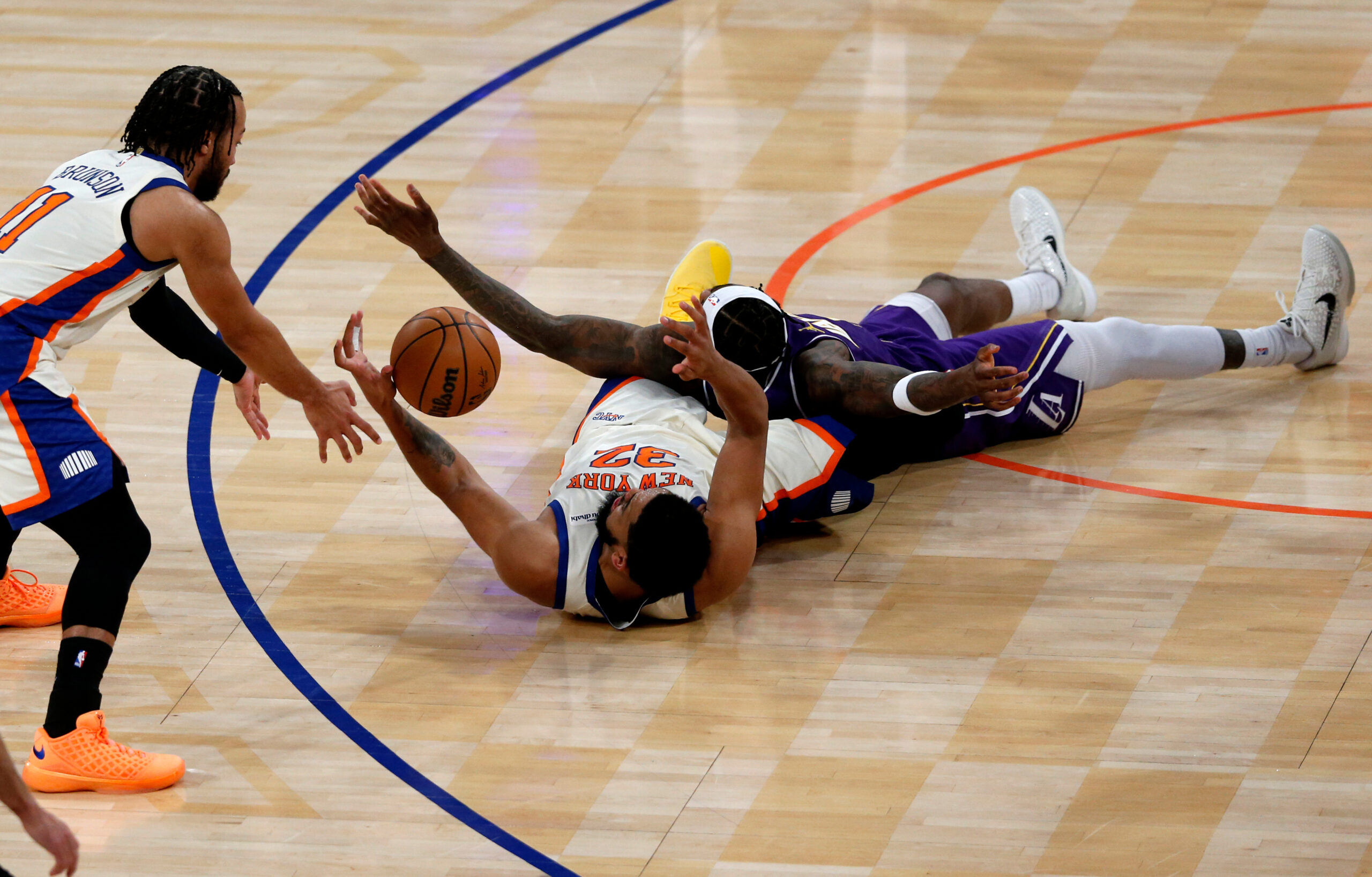 New York Knicks guard Jalen Brunson, left, Knicks center Karl-Anthony...