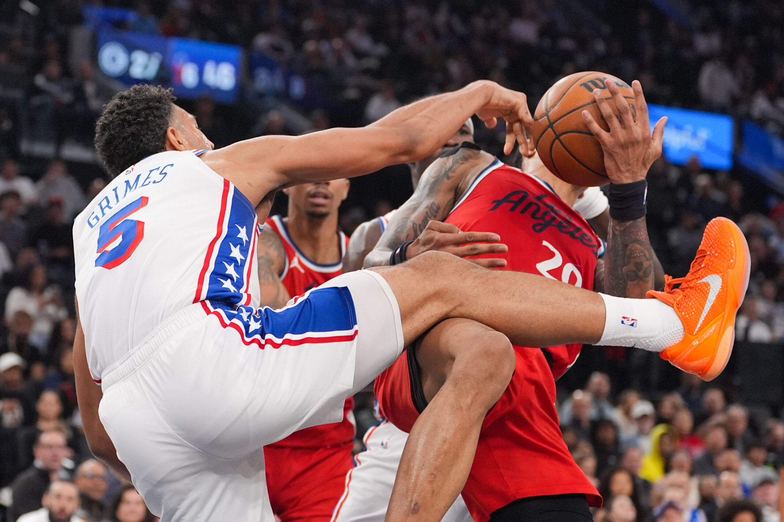 Philadelphia 76ers guard Quentin Grimes (5) descends after he dunked...