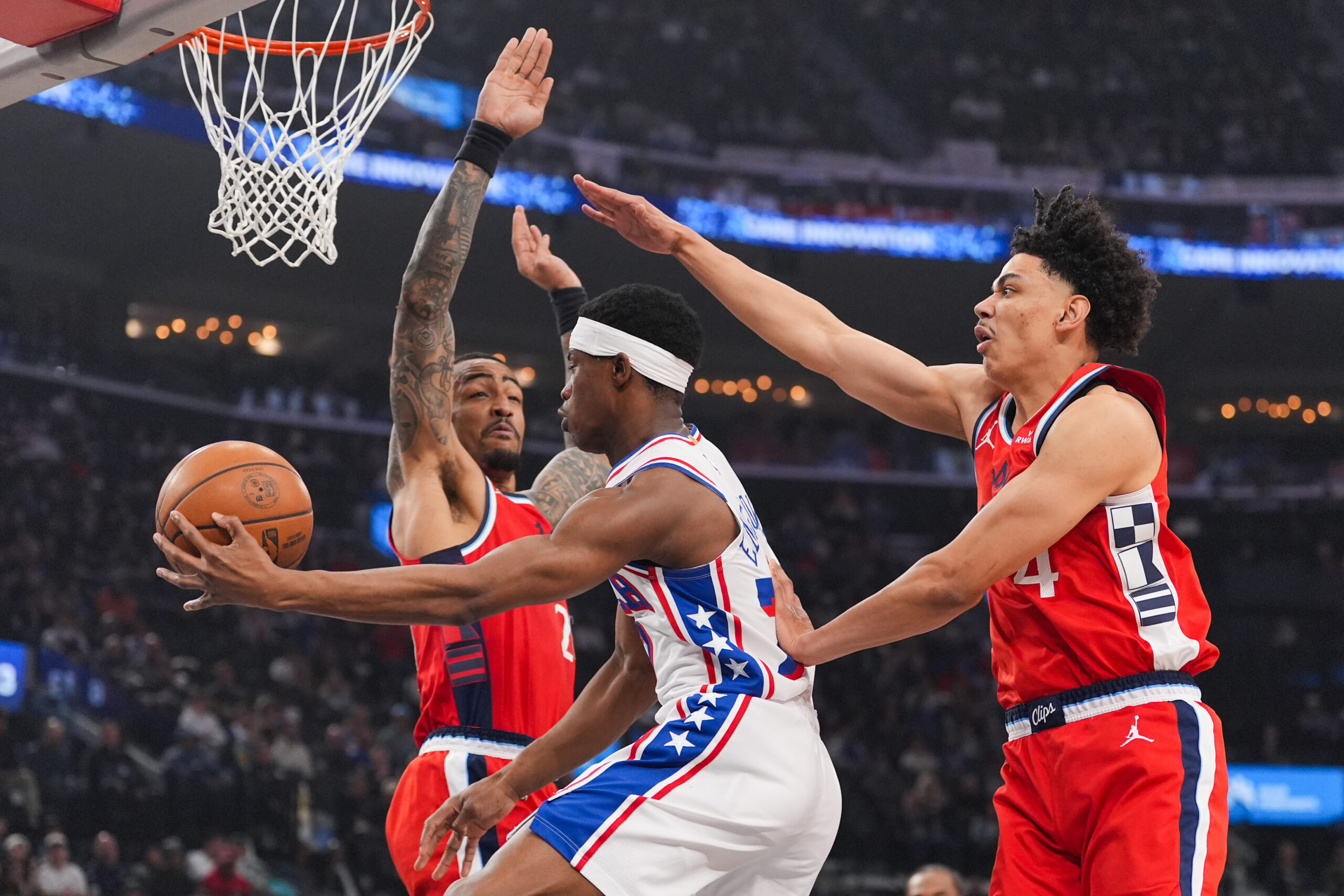 Philadelphia 76ers guard Vj Edgecombe (77) passes the ball under...