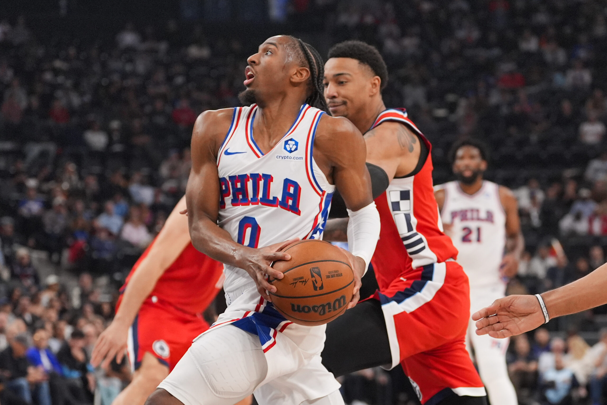 Philadelphia 76ers guard Tyrese Maxey (0) drives to the basket...