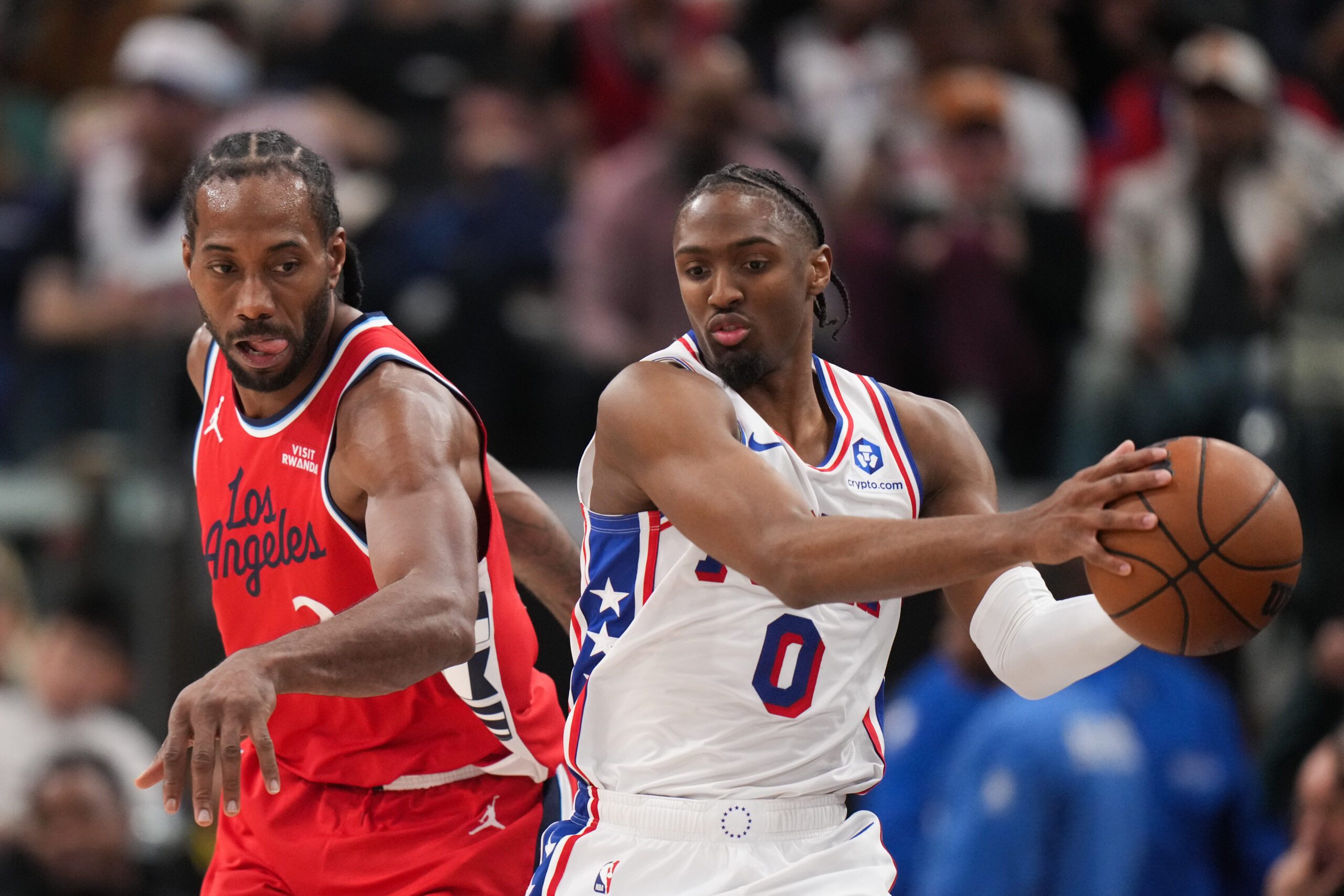 Philadelphia 76ers guard Tyrese Maxey grabs the ball in front...