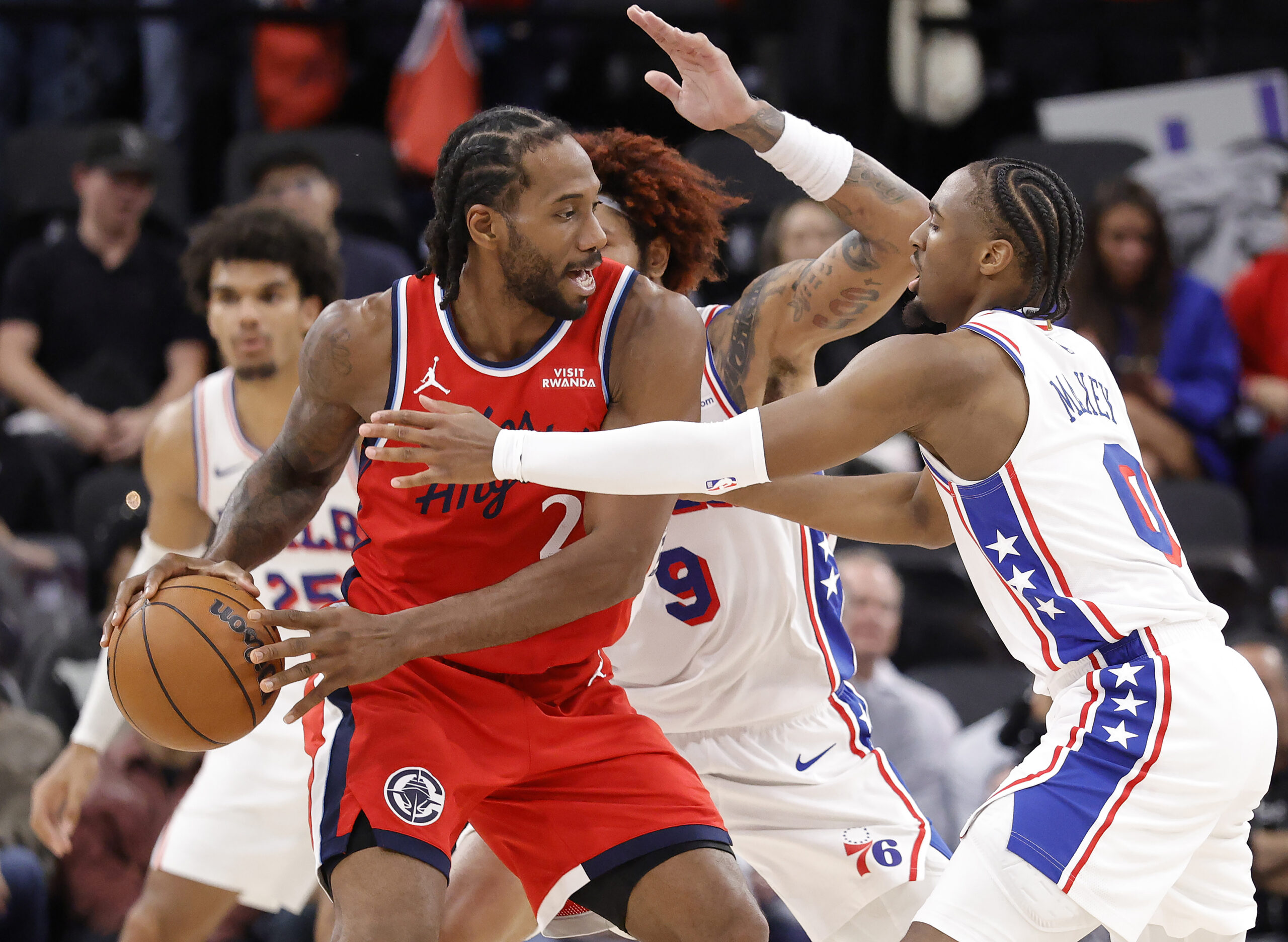 Clippers star Kawhi Leonard controls the ball as the Philadelphia...