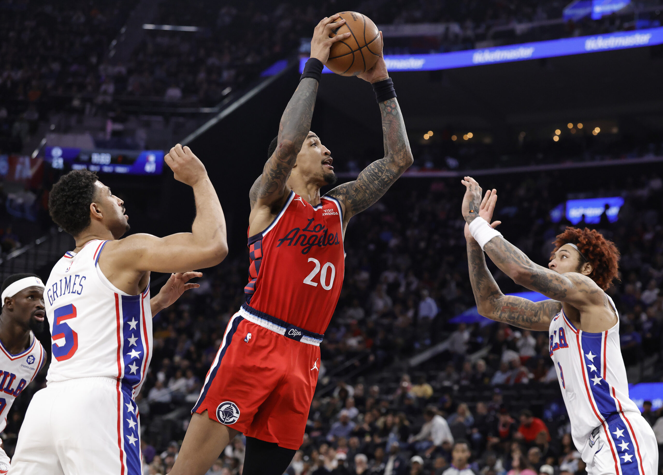 Clippers forward John Collins takes a shot during the first...